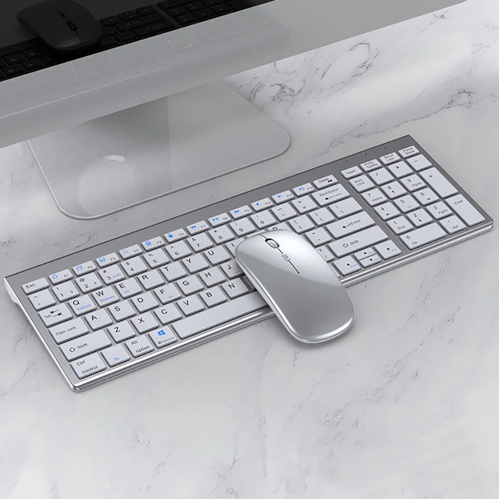 O Conjunto de Teclado e Mouse Slim Bluetooth oferece praticidade e elegância para o seu dia a dia, sendo compatível com notebooks e computadores. Com conexão sem fio dupla via Bluetooth e USB 2.4G, garante uma experiência estável e sem atrasos. Ambos os dispositivos são recarregáveis, eliminando a necessidade de pilhas, e possuem um design slim e silencioso, ideal para uso em escritórios ou home office. Leve, compacto e eficiente, esse conjunto é perfeito para quem busca conforto e produtividade em qualquer